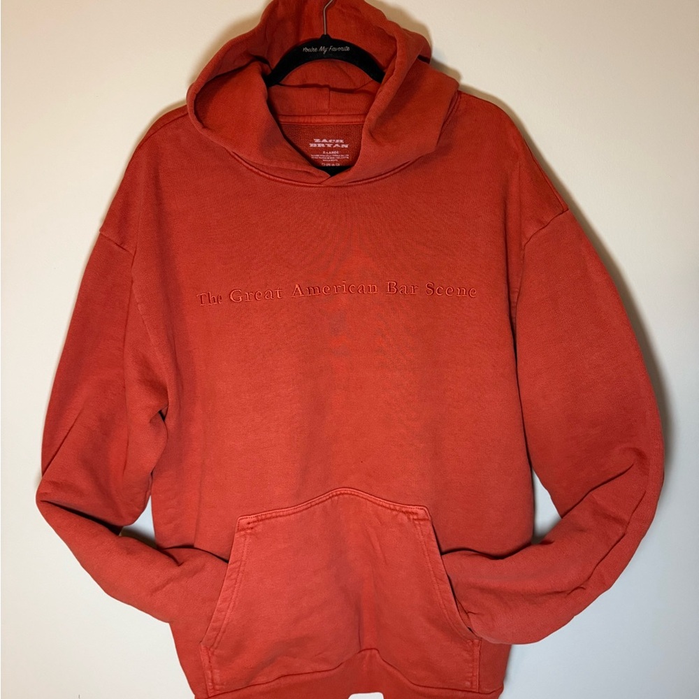 Zach Bryan The Great American Bar Scene Rust Red Hoodie with Embroidered Detail